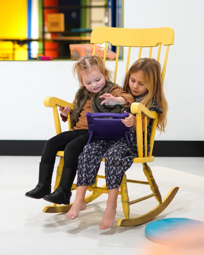 kids reading on a chair