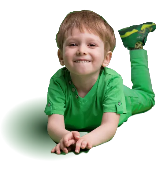 Smiling boy in green cloths