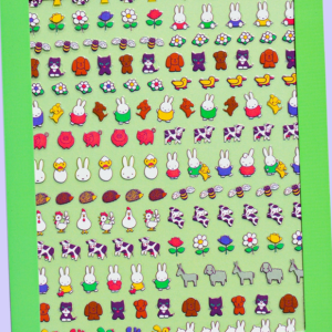Bright green sticker sheet densely covered with small colorful illustrated characters and objects arranged in rows.