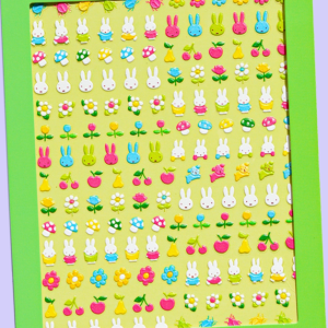 Sticker sheet filled with bright green, yellow, and multicolored Miffy-themed icons arranged in a dense grid.