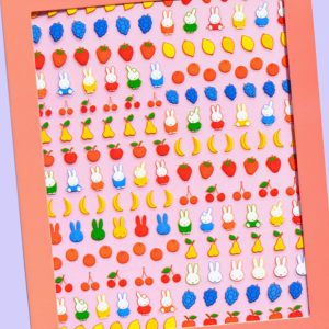 Orange sticker sheet displaying rows of small, brightly colored illustrated icons and characters.