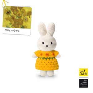 Knitted white Miffy rabbit in a yellow dress with sunflower print.