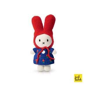 Knitted white Miffy rabbit in a blue tulip-patterned dress and a red hat.