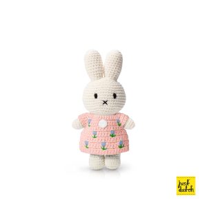 Knitted white Miffy rabbit in a pastel pink dress with a tulip pattern.