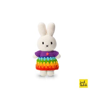 Knitted white Miffy rabbit in a multicolored striped dress in rainbow colors.