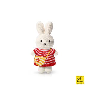 Knitted white Miffy rabbit in a red and white striped dress, holding a small yellow and white striped bag with a flower detail.