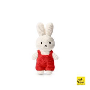 Knitted white Miffy rabbit in a red overall.