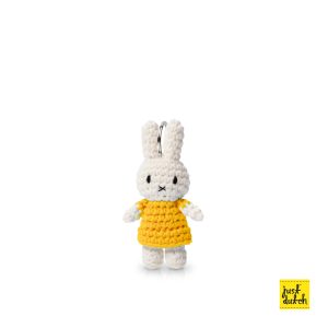 Knitted white Miffy rabbit keyhanger in a yellow colored dress.