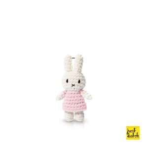 Knitted white Miffy rabbit keyhanger in a pastel pink colored dress.