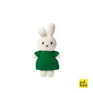 Knitted white Miffy rabbit in a green outfit and one ear down.