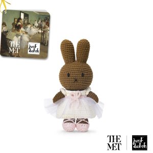 Knitted brown Melanie rabbit in a white and light pink princess-style dress, standing upright on white background