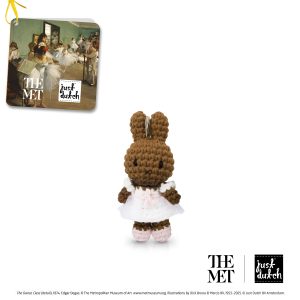 Knitted brown Melanie rabbit keychain in a white and light pink princess-style dress.