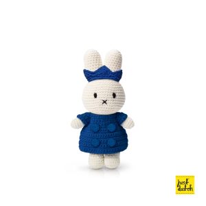 Knitted white Miffy rabbit in a blue coat-style outfit and a blue crown.