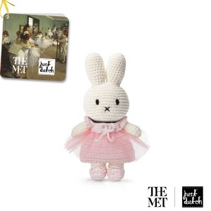 Knitted white knitted rabbit doll in a pink tutu dress and pink ballet shoes.