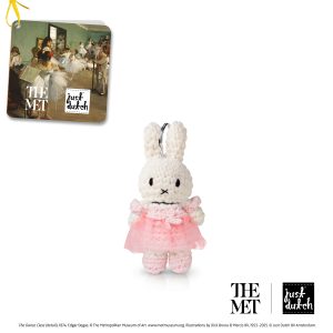 Knitted white Miffy rabbit keychain in a soft pink knitted dress on white background