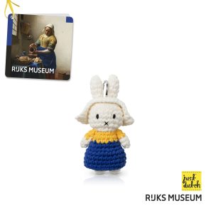 Knitted white Miffy rabbit in a light yellow and blue knitted dress with white bonnet.