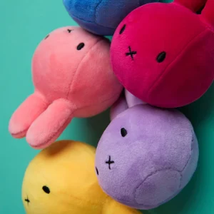Stack of Miffy rabbit head plushes in multiple bright colors arranged vertically